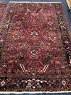 A Persian red ground rug 285 c 190cm                                                                                                   