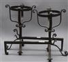 A pair of wrought iron fire dogs                                                                                                       