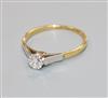 An 18ct gold and platinum set solitaire diamond ring, size M.                                                                          