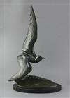 Irénée Rochard (1906-1984). A French Art Deco green patinated bronze model of a seagull flying over a wave, height 28in.               