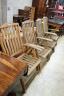 A set of four weathered teak folding garden armchairs, width 63cm, depth 56cm, height 114cm                                                                                                                                 