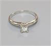 A 14ct white gold and solitaire princess cut diamond ring, size G.                                                                     