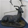 A large bronzed metal model of a recumbent stag H.88cm                                                                                 