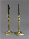 A pair of mid 18th century brass candlesticks, 9in.                                                                                    