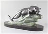 M. LeDucq. An Art Deco patinated spelter model of a panther upon a rock, 23in.                                                         