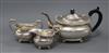 An Edwardian three-piece silver tea service, London shape with shell and gadroon borders on ball feet, 29.5oz (gross)                  