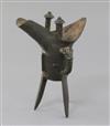 A Chinese archaic bronze wine vessel, Jue, Shang dynasty or later, height 19cm, repair to one leg                                      