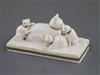 A Rockingham porcelain group of a cat and three kittens, c.1830, L. 11.2cm                                                             