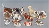 Ten Crown Derby paperweights: Labrador, Staffordshire Bull terrier, Collie, Spaniel, Foxhound, Jack Russell and four puppies           