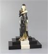E.Menneville. A French Art Deco phenolic and bronzed spelter figure of a lady descending a staircase, 'L'Elegante', 17.5in.            