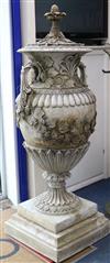 A pair of reconstituted stone Neo-Classical two handled campana shaped lidded urns, on plinths H.177cm                                 