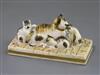 A Rockingham porcelain group of a cat and three kittens, c.1830, L. 11cm, restored                                                     