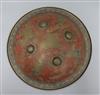 A Benares engraved brass and red enamel shield diameter 36cm                                                                           