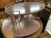 A brass mounted simulated rosewood oval two tier tea trolley, c.1970, width 70cm depth 45cm height 68cm                                                                                                                     