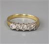 A modern 18ct gold and five stone diamond ring, size I.                                                                                