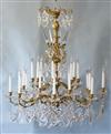 A Louis XV style ormolu and cut glass twenty four light chandelier, Diam.3ft 2in. Drop 4ft 2in.                                        