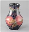 A Moorcroft pomegranate pattern baluster vase, height 6.75in.                                                                          