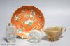 A Chinese jadeite roundel, an agate sauceboat, an inside painted snuff bottle and a ceramic charger, Qing period or later, diameter 14cm                                                                                    