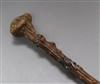 A late 19th century gnarled walking stick with white metal fox chasing a squirrel                                                      