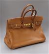 A Hermes tan leather Birkin handbag, with dust bag (puchased 1998 from Paris store) Width 35cm                                         