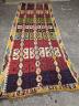 A Kelim polychrome flatweave carpet , cut centrally and re stitched, 425 x 163cm                                                                                                                                            
