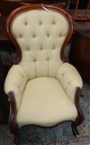 A Victorian walnut deep-buttoned armchair on cabriole legs                                                                             