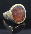 An antique gold mounted Roman? intaglio carnelian ring, size L.                                                                        