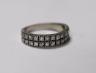 A white metal and two row round cut diamond set half eternity ring, size M, gross weight 3.9 grams.                                                                                                                         