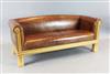 A David Linley tan leather settee, W.6ft D.2ft 6in. H.2ft 4in.                                                                         