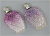 A pair of late Victorian silver lidded amethyst tinted cut glass scent flasks, 13.5cm.                                                 