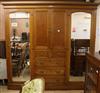 An Edwardian lemon wood triple wardrobe W.244cm                                                                                        