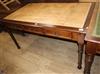 A Victorian style mahogany three drawer writing table W.150cm                                                                          