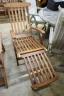 A brass mounted teak garden steamer chair, labelled Lindsey                                                                                                                                                                 