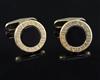 A pair of modern Bulgari 18k, 585(14k) and black onyx set circular cufflinks,                                                          