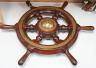 An early 20th century teak and brass mounted ship’s wheel 64cm                                                                                                                                                              