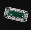 An Art Deco platinum?, chrysophase, emerald and diamond millegrain set octagonal brooch, gross weight 10.3 grams.                      