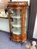 An early 20th century French gilt metal mounted rosewood vitrine, with central serpentine glazed door marquetry inlaid with flowers in a basket, on cabriole legs, width 74cm depth 48cm height 172cm                       