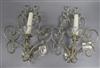 A pair of glass bead and silvered metal two branch wall sconces length 31cm                                                            