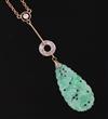 A 1940's/1950's? gold, carved jade and diamond set drop pendant necklace, (chain a.f.), gross weight 4.3 grams.                        