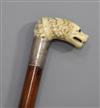 A good mid 19th century carved ivory handled cane, length 35.25in.                                                                     