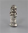 A late Victorian novelty silver vesta case modelled as a baby wrapped in swaddling clothes, Edwin Thompson Bryant, London, 1895,       