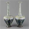 Eliza Simmance for Royal Doulton, a pair of Art Nouveau lily design bottle vases, c.1910, 30cm                                         