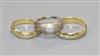 Two 18ct gold and gypsy set solitaire diamond rings including white gold and an 18ct gold and gypsy set three stone diamond ring.      