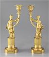 A pair of Regency gilt brass chinoiserie candlesticks, height 9.25in.                                                                  