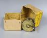 An Allcock brass fishing reel, 6cm. diam., in original box                                                                                                                                                                  