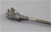 A Victorian novelty silver buttonhook, the terminal modelled as the head of a dog, 30.2cm.                                             