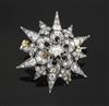 A Victorian gold, silver and diamond set pierced starburst brooch, 33mm.                                                               