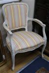 A pair of Louis XV style white painted fauteuils                                                                                       