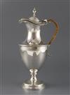 A late Victorian silver claret/hot water jug by Hawksworth, Eyre & Co, gross 29.5 oz.                                                  