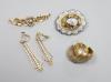 An Edwardian 15ct and seed pearl set bar brooch, 47mm, gross 4 grams, two pairs of 9ct earrings, gross 5,2 grams and a Victorian yellow metal and enamel (a.f.) mourning brooch.                                            